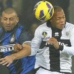 Inter Milan's Walter Samuel jumps for the ball with Jonathan Biabiany of Parma during their Serie A soccer match at the Tardini stadium in Parma